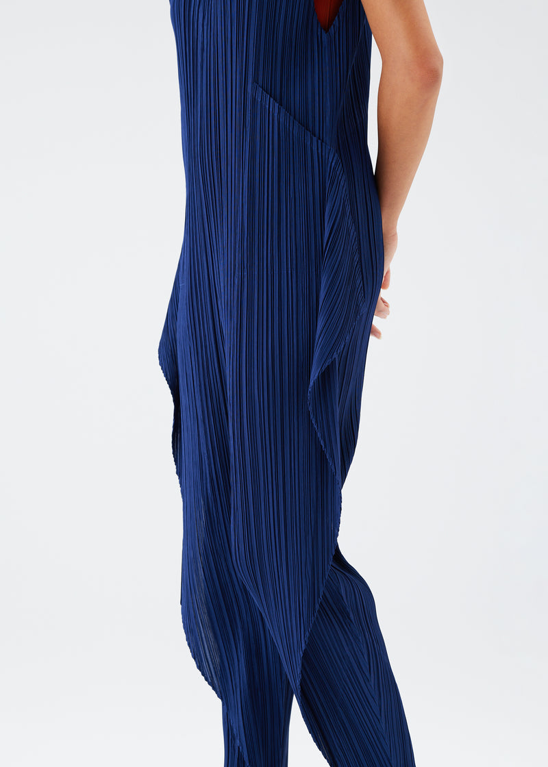 A model wears the PLEATS PLEASE ISSEY MIYAKE  THICKER BOTTOMS 1 jumpsuit