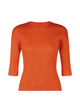 A product shot of the PLEATS PLEASE ISSEY MIYAKE  MONTHLY COLORS JULY top in dark orange (33)