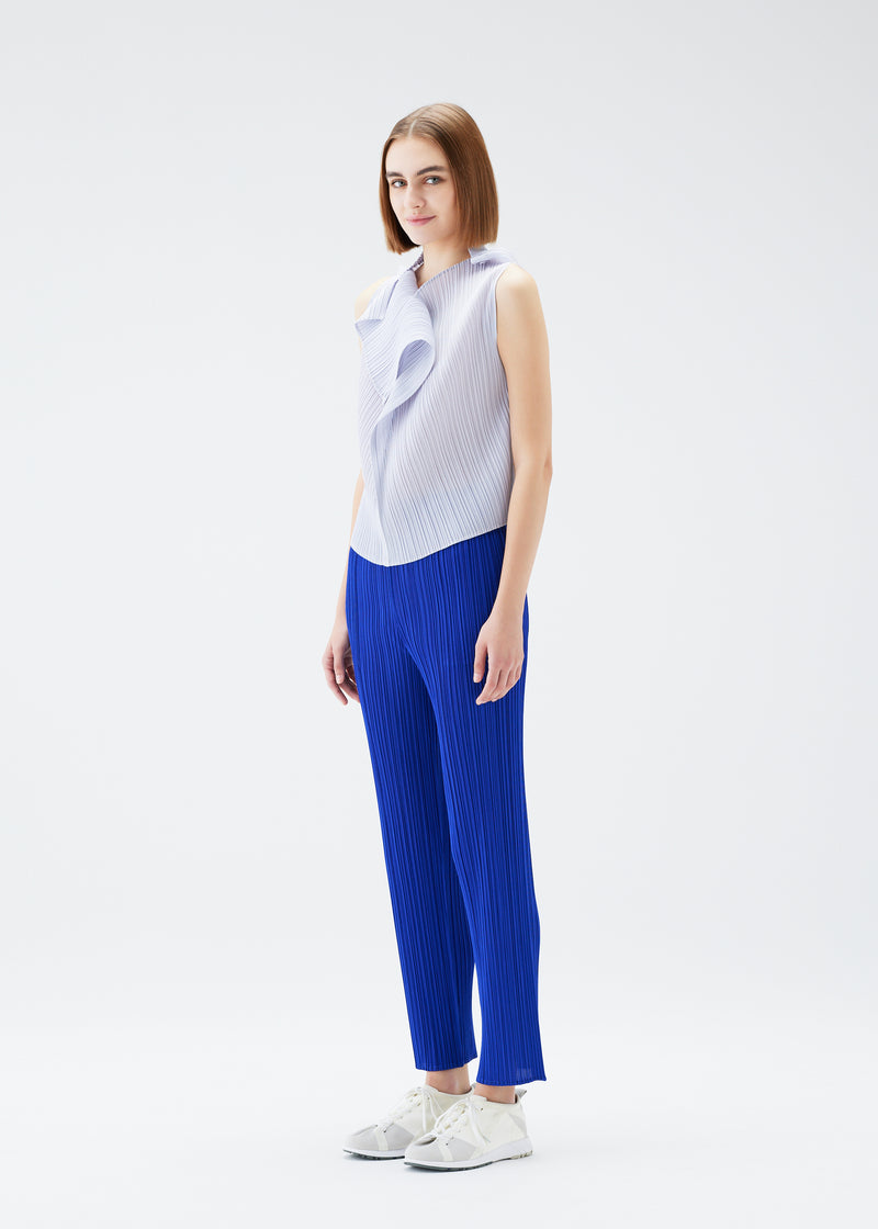 A model wears the PLEATS PLEASE ISSEY MIYAKE  MONTHLY COLORS JULY top