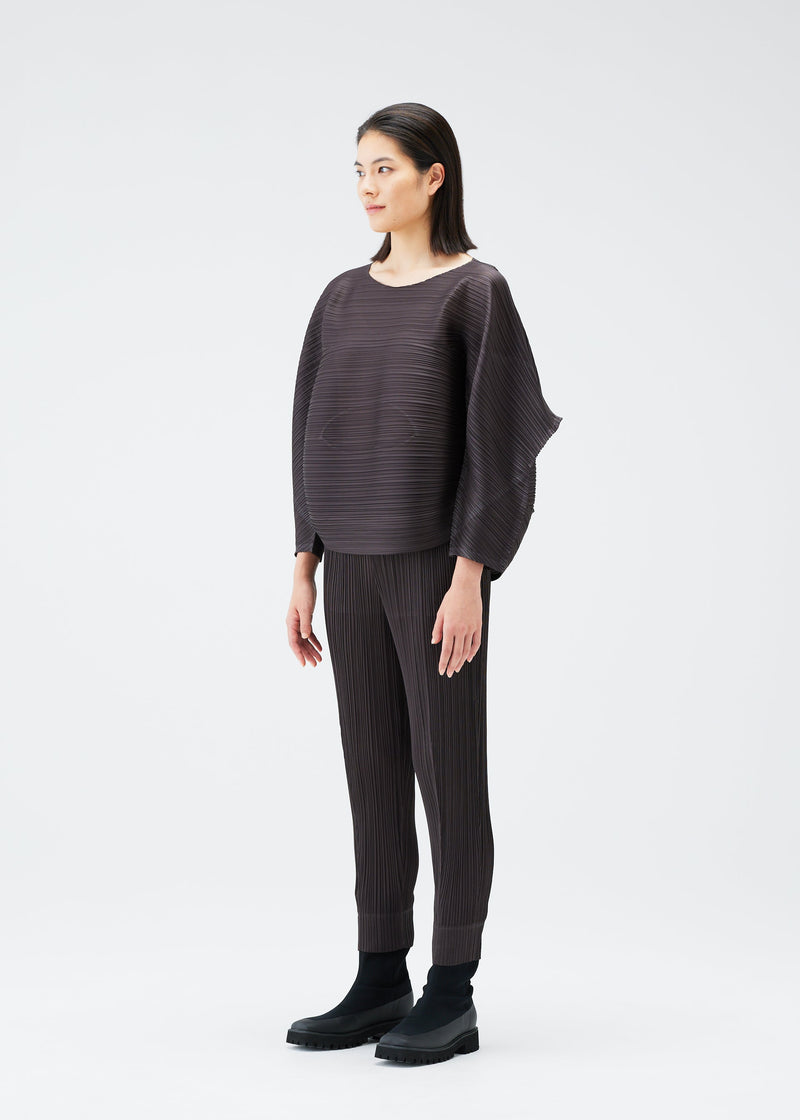 A model wears the PLEATS PLEASE ISSEY MIYAKE UFO top.