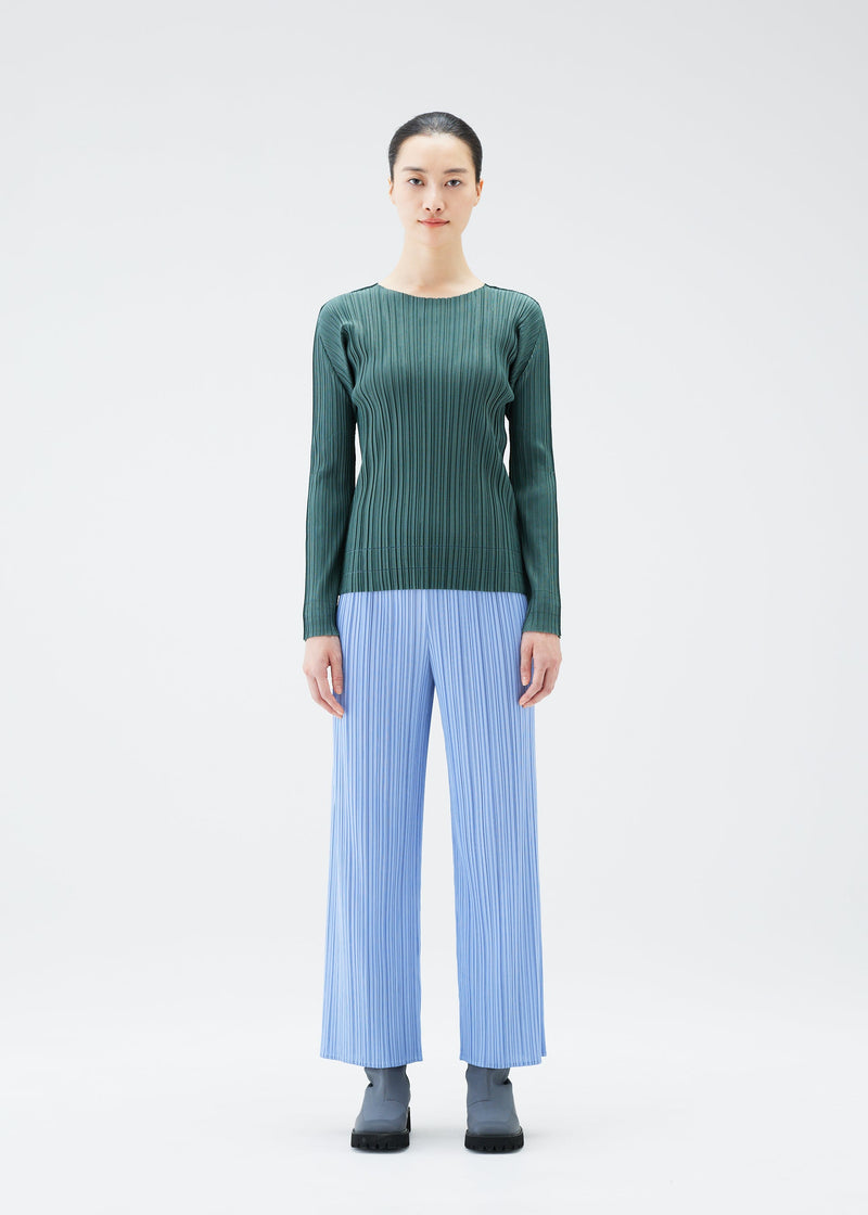 A model wears the PLEATS PLEASE ISSEY MIYAKE SOFT PLEATS top.