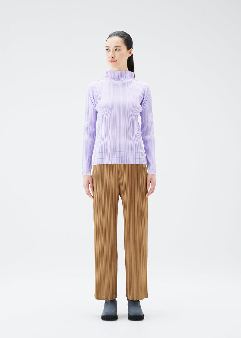 A model wears the PLEATS PLEASE ISSEY MIYAKE SOFT PLEATS top.