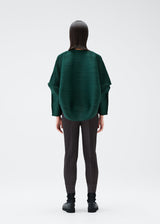 A model wears the PLEATS PLEASE ISSEY MIYAKE UFO cardigan.