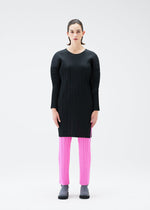 A model wears the PLEATS PLEASE ISSEY MIYAKE MONTHLY COLORS OCTOBER tunic.