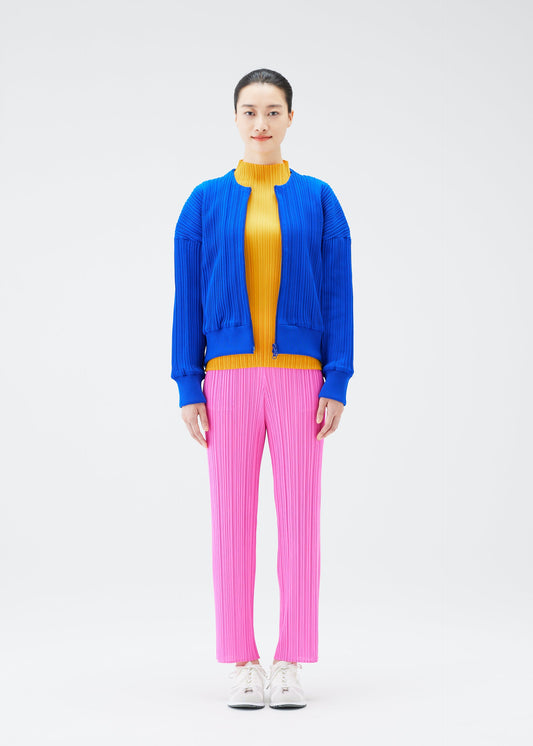 A model wears the PLEATS PLEASE ISSEY MIYAKE CREPE KNIT jacket.