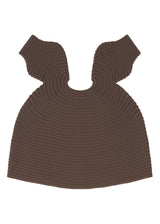 A detail shot of the PLEATS PLEASE ISSEY MIYAKE  MUSHROOM KNIT dress