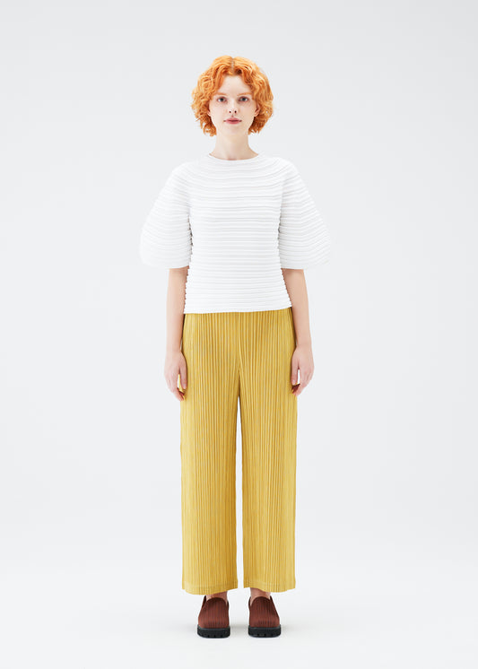 A model wears the PLEATS PLEASE ISSEY MIYAKE  MUSHROOM KNIT top