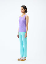 A model wears the PLEATS PLEASE ISSEY MIYAKE MIST APRIL top.