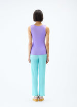 A model wears the PLEATS PLEASE ISSEY MIYAKE MIST APRIL top.