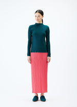 A model wears the PLEATS PLEASE ISSEY MIYAKE RIB PLEATS JANUARY top.