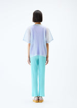 A model wears the PLEATS PLEASE ISSEY MIYAKE TATAMI APRIL top.