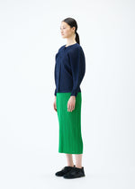 A model wears the PLEATS PLEASE ISSEY MIYAKE RIB PLEATS FEBRUARY cardigan.