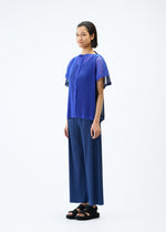 A model wears the PLEATS PLEASE ISSEY MIYAKE SHEER SQUARE cardigan.
