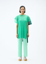 A model wears the PLEATS PLEASE ISSEY MIYAKE SHEER SQUARE tunic.