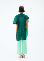 A model wears the PLEATS PLEASE ISSEY MIYAKE SHEER SQUARE tunic.