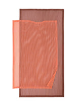 A detail shot of the PLEATS PLEASE ISSEY MIYAKE SHEER SQUARE tunic.