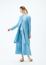 A model wears the PLEATS PLEASE ISSEY MIYAKE MELLOW PLEATS coat.