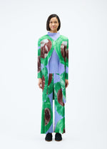 A model wears the PLEATS PLEASE ISSEY MIYAKE BACKLIGHT coat.