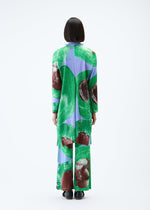 A model wears the PLEATS PLEASE ISSEY MIYAKE BACKLIGHT coat.