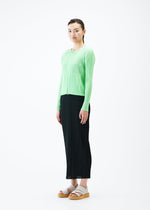 A model wears the PLEATS PLEASE ISSEY MIYAKE MONTHLY COLORS MAY jacket.