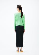 A model wears the PLEATS PLEASE ISSEY MIYAKE MONTHLY COLORS MAY jacket.