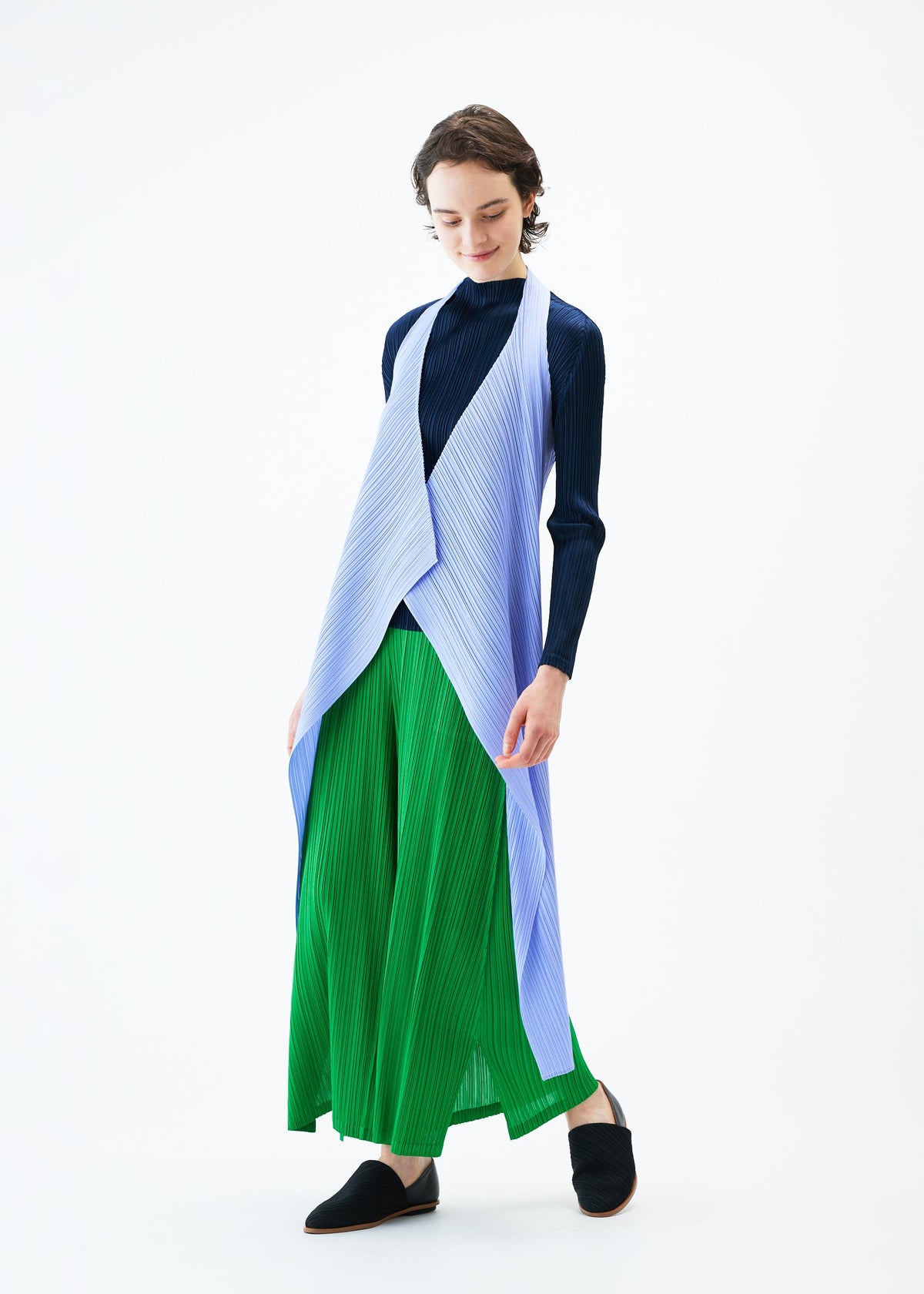 A model wears the PLEATS PLEASE ISSEY MIYAKE MONTHLY COLORS FEBRUARY vest.
