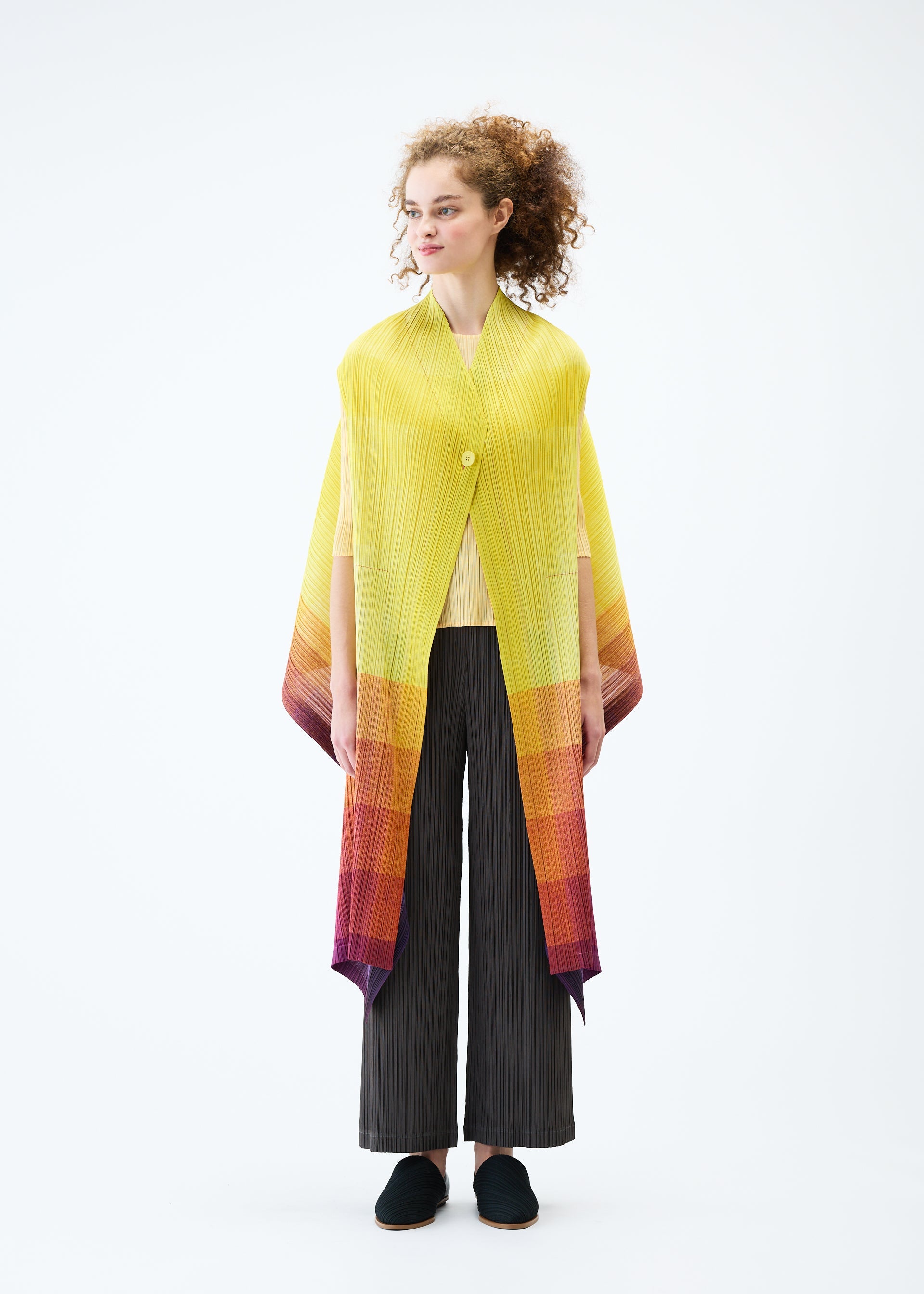 A model wears the PLEATS PLEASE ISSEY MIYAKE PHOTON vest.