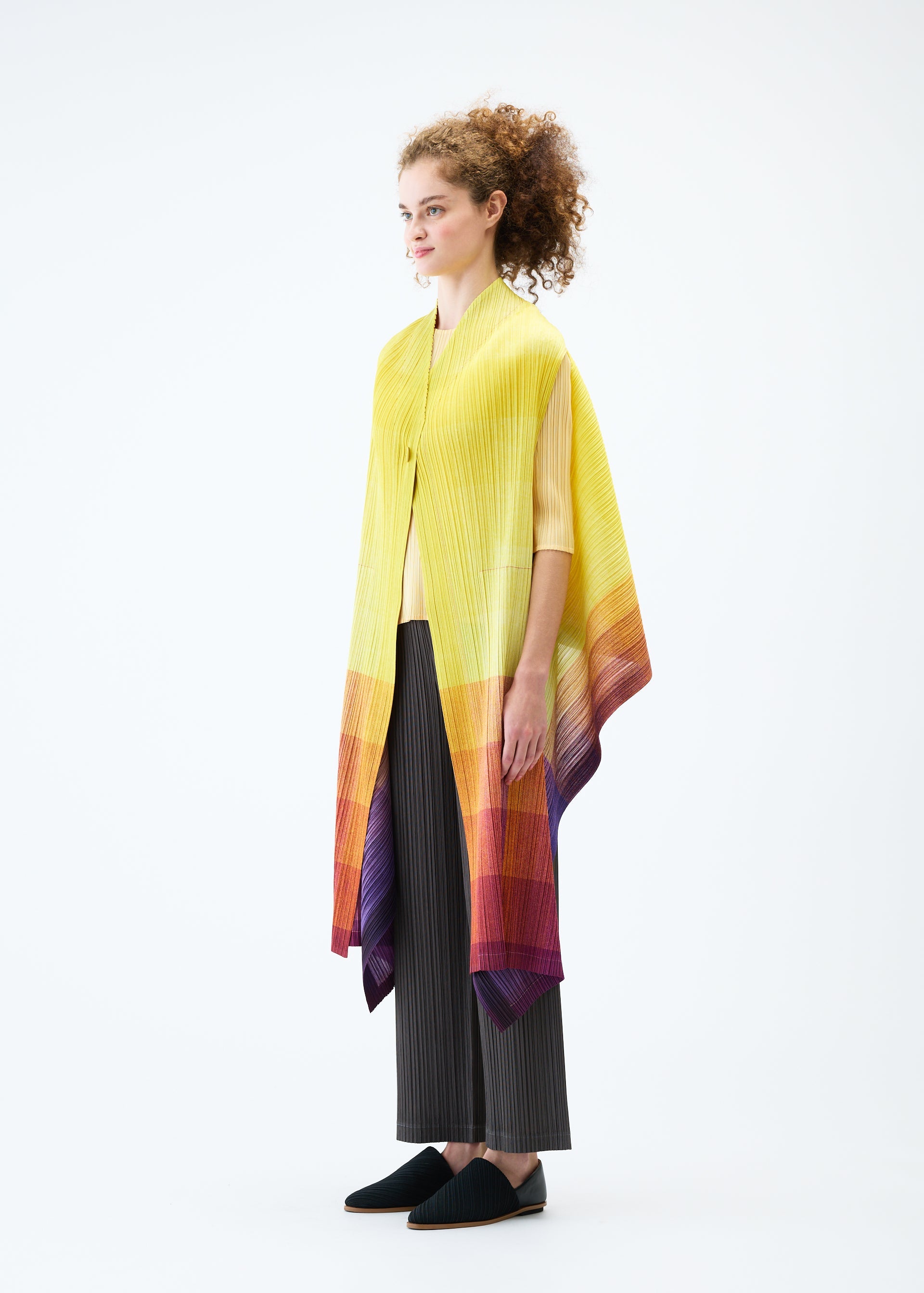 A model wears the PLEATS PLEASE ISSEY MIYAKE PHOTON vest.