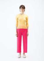 A model wears the PLEATS PLEASE ISSEY MIYAKE MONTHLY COLORS MARCH trousers.