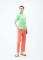 A model wears the PLEATS PLEASE ISSEY MIYAKE MONTHLY COLORS MAY trousers.