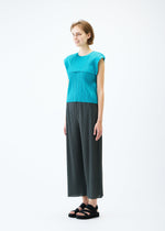 A model wears the PLEATS PLEASE ISSEY MIYAKE MONTHLY COLORS : JUNE trousers.