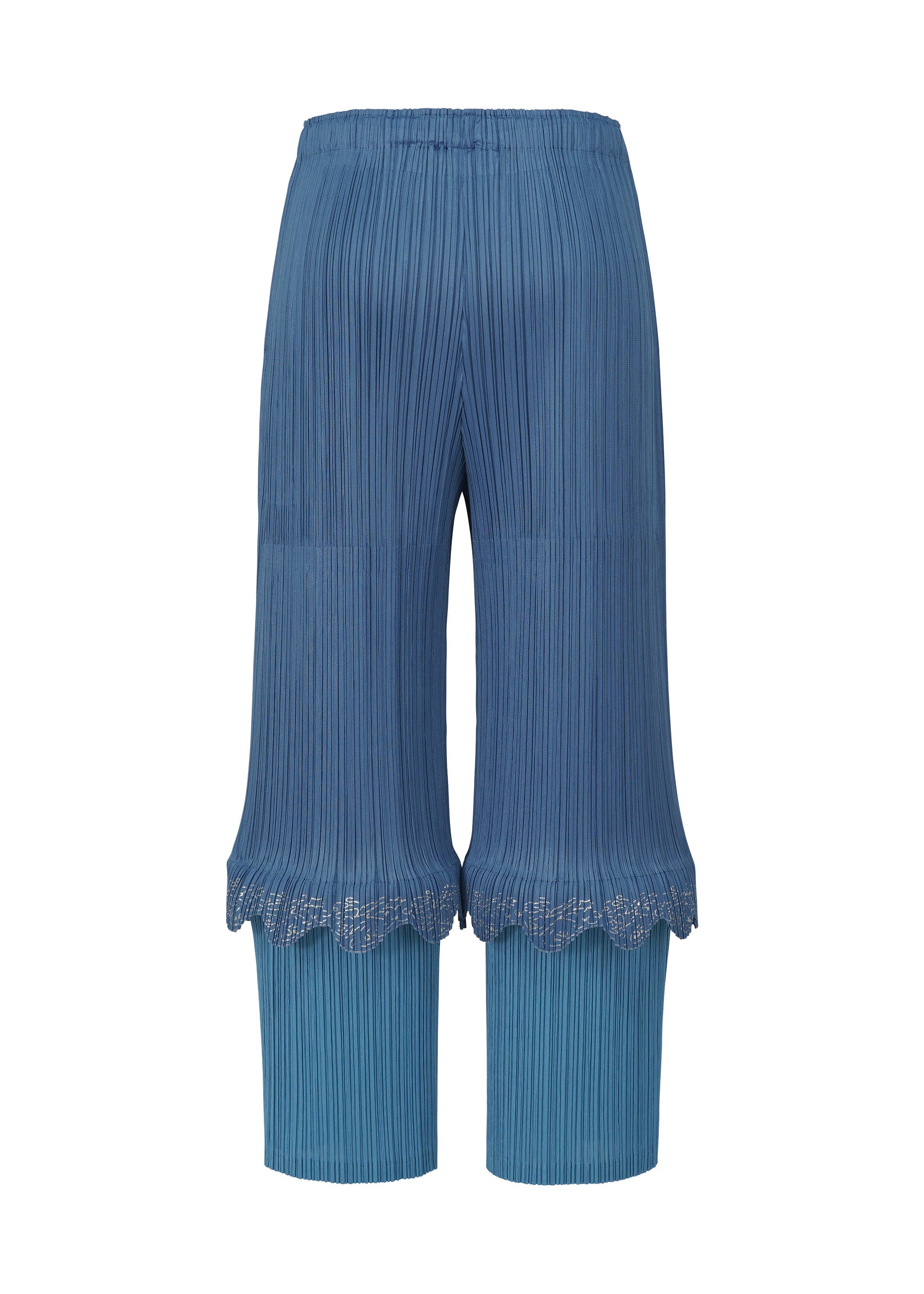 A detail shot of the PLEATS PLEASE ISSEY MIYAKE TWINKLE trousers.
