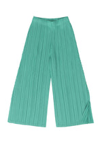 A detail shot of the PLEATS PLEASE ISSEY MIYAKE MELLOW PLEATS trousers.