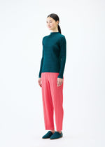 A model wears the PLEATS PLEASE ISSEY MIYAKE THICKER BOTTOMS 1 trousers.