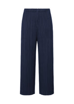 A product shot of the PLEATS PLEASE ISSEY MIYAKE MERRY BICOLOR trousers in navy (75).
