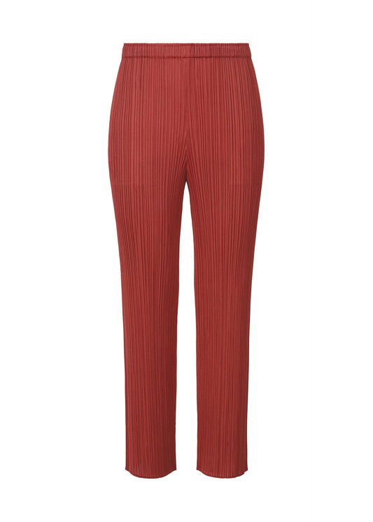 A product shot of the PLEATS PLEASE ISSEY MIYAKE LAMP SHADE trousers in dark red (27).