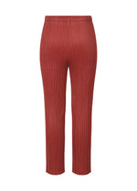 A detail shot of the PLEATS PLEASE ISSEY MIYAKE LAMP SHADE trousers.