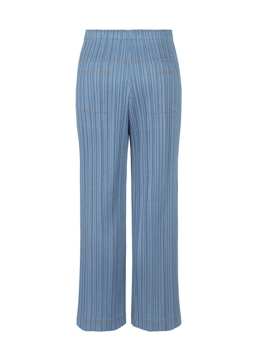 A detail shot of the PLEATS PLEASE ISSEY MIYAKE COTTON DENIM trousers.