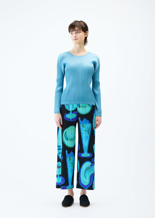 A model wears the PLEATS PLEASE ISSEY MIYAKE THERMAL FOODS trousers.