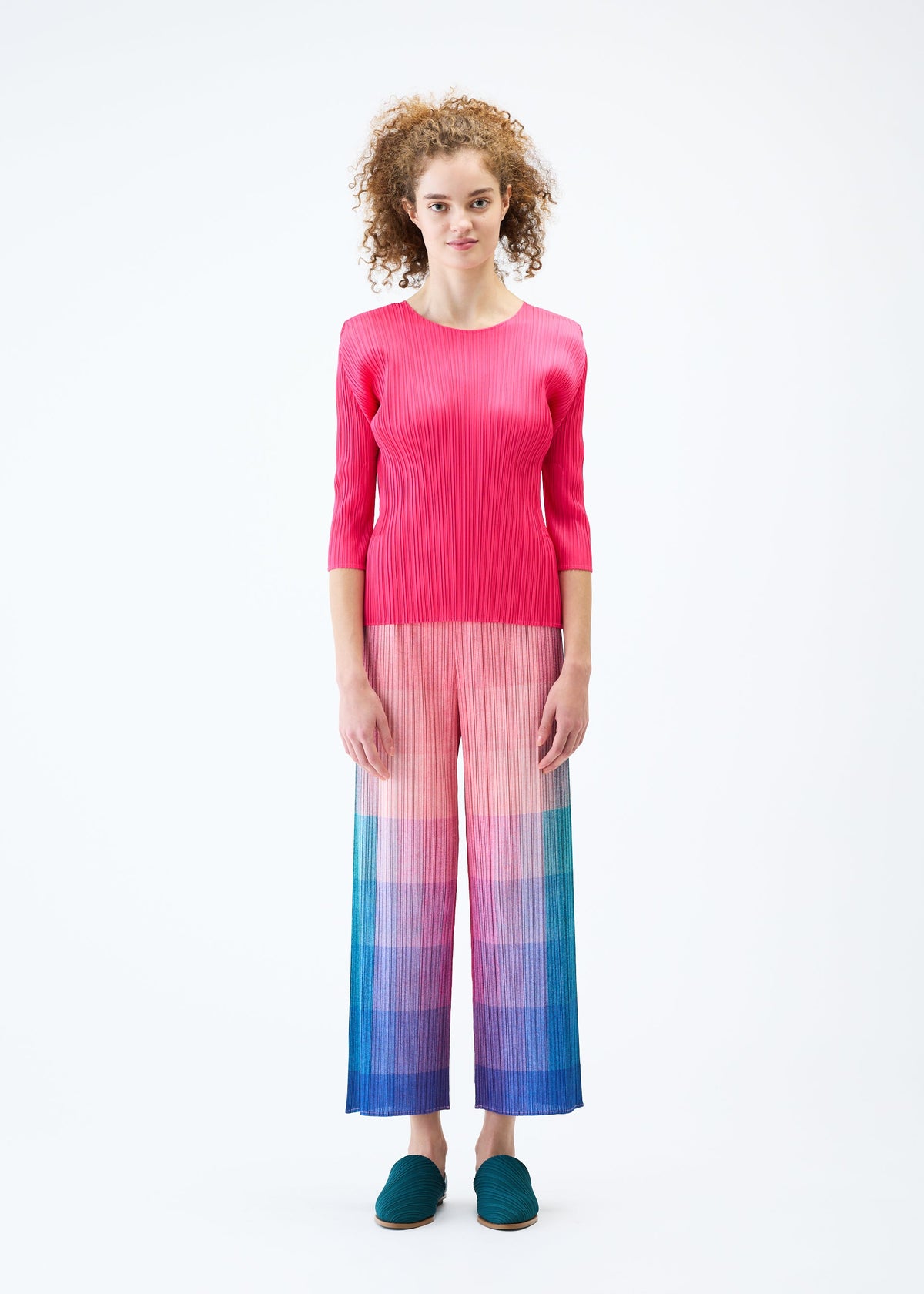 A model wears the PLEATS PLEASE ISSEY MIYAKE PHOTON trousers.