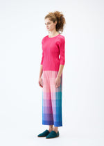 A model wears the PLEATS PLEASE ISSEY MIYAKE PHOTON trousers.