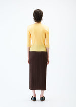 A model wears the PLEATS PLEASE ISSEY MIYAKE MONTHLY COLORS MARCH skirt.