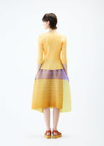 A model wears the PLEATS PLEASE ISSEY MIYAKE PHOTON BOUNCE skirt.