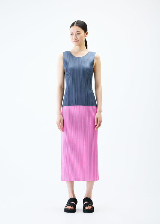 A model wears the PLEATS PLEASE ISSEY MIYAKE LOOP BOTTOMS skirt.