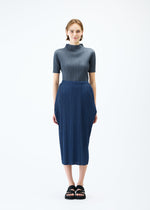 A model wears the PLEATS PLEASE ISSEY MIYAKE LAMP SHADE skirt.