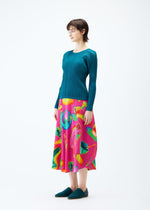 A model wears the PLEATS PLEASE ISSEY MIYAKE THERMAL FOODS skirt.