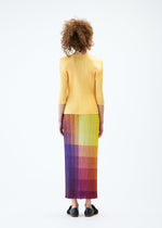 A model wears the PLEATS PLEASE ISSEY MIYAKE PHOTON skirt.