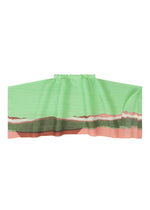 A detail shot of the PLEATS PLEASE ISSEY MIYAKE GRAINY COLORS skirt.
