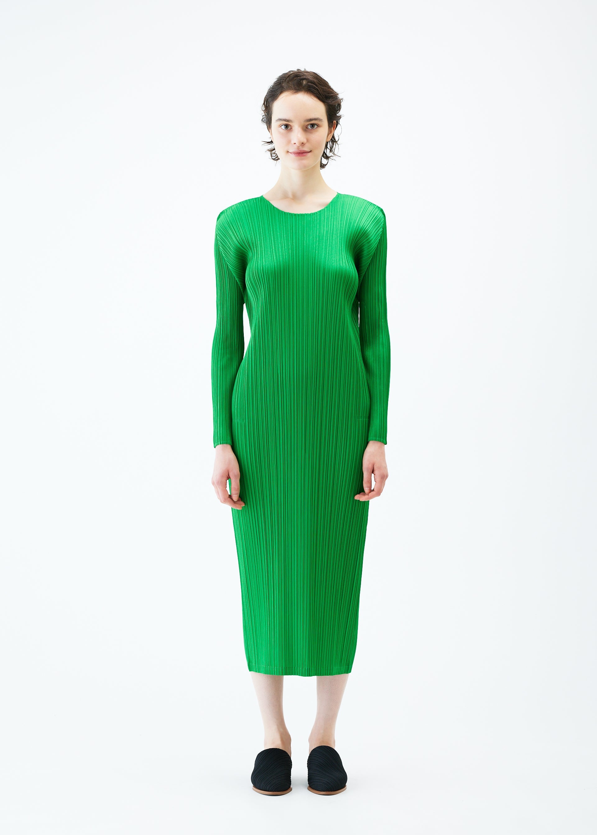 A model wears the PLEATS PLEASE ISSEY MIYAKE MONTHLY COLORS FEBRUARY dress.