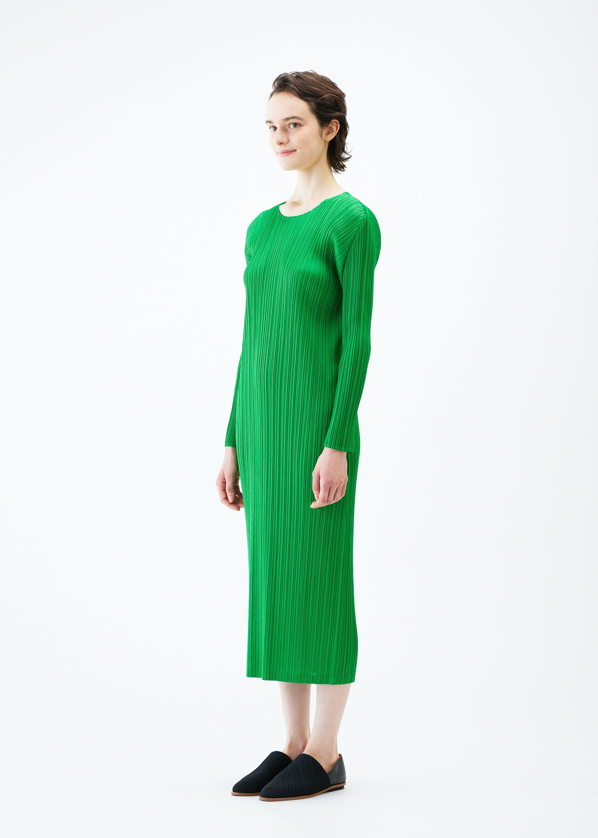 A model wears the PLEATS PLEASE ISSEY MIYAKE MONTHLY COLORS FEBRUARY dress.